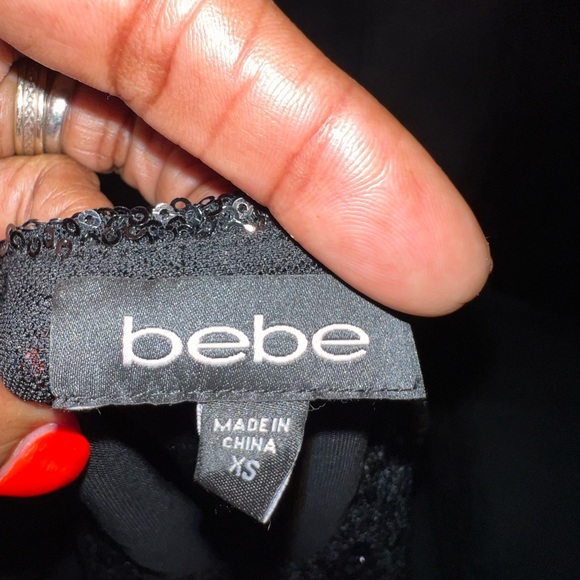 Beautiful black sequined blouse can be paired with a skirt or denim jeans. Bebe - Picture 3 of 6